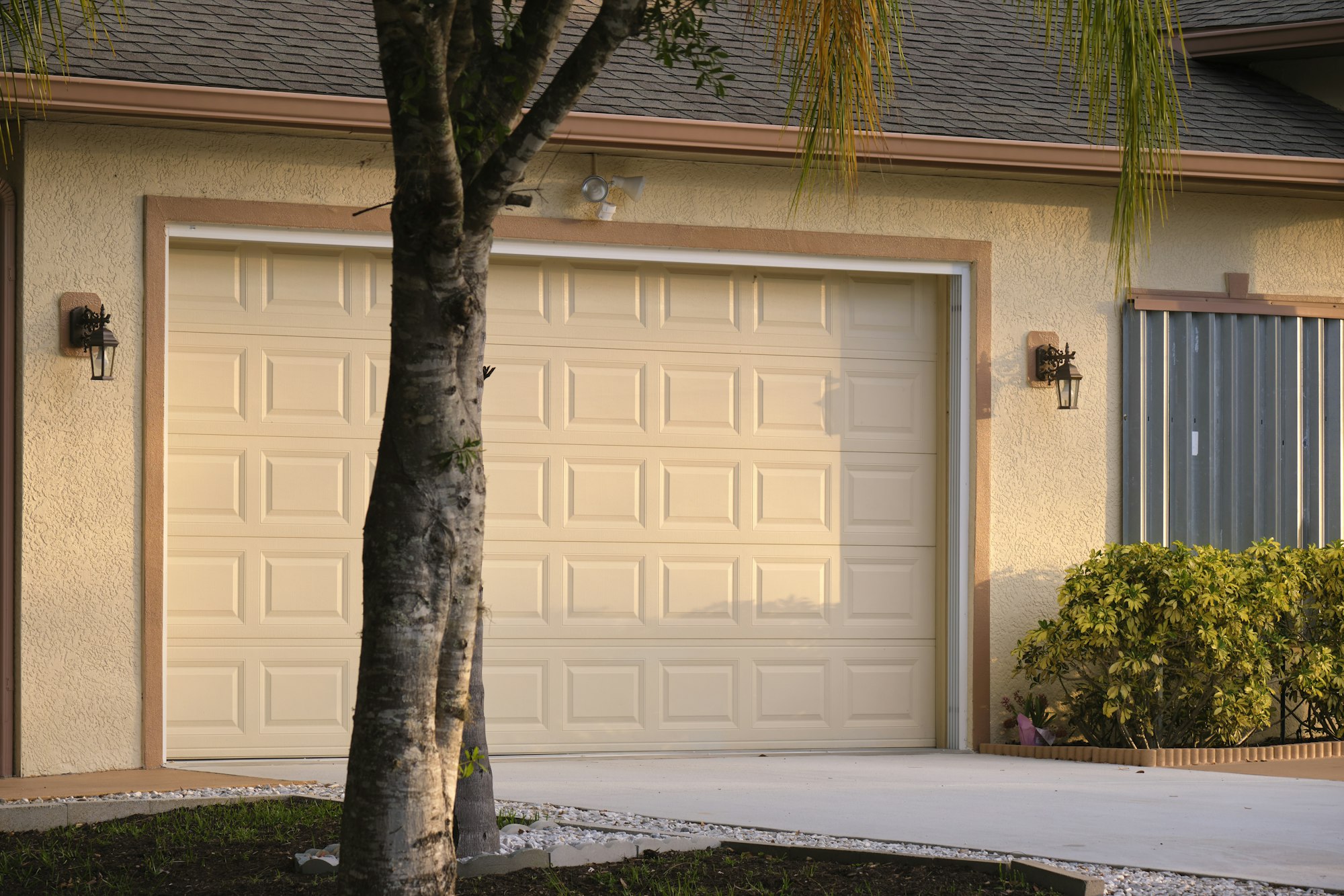 Wide garage double door and concrete driveway of new modern american house